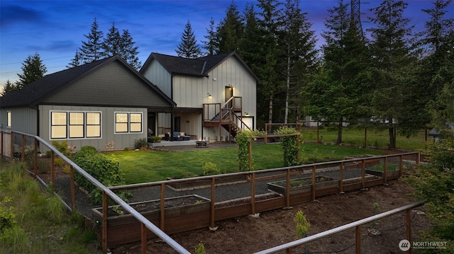 321 W Berry Ridge Rd, Shelton, WA 98584 - rear view of property featuring a garden, board and batten siding, stairs, and a patio area