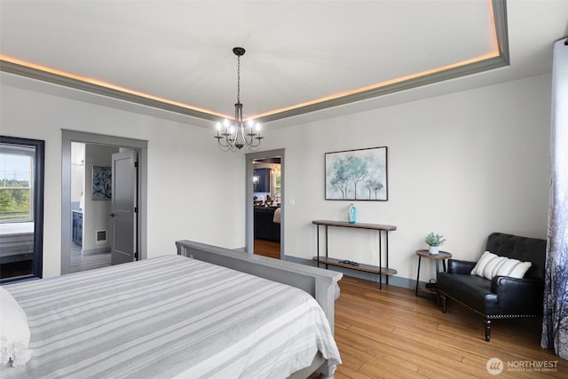 321 W Berry Ridge Rd, Shelton, WA 98584 - bedroom with a tray ceiling, a chandelier, and light wood-style floors