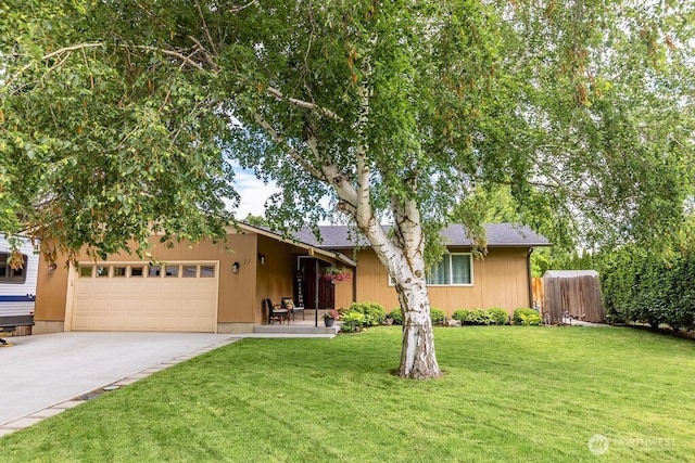19 Mckay Pl, Walla Walla, WA 99362 - view of front of property featuring a garage, concrete driveway, and a front lawn