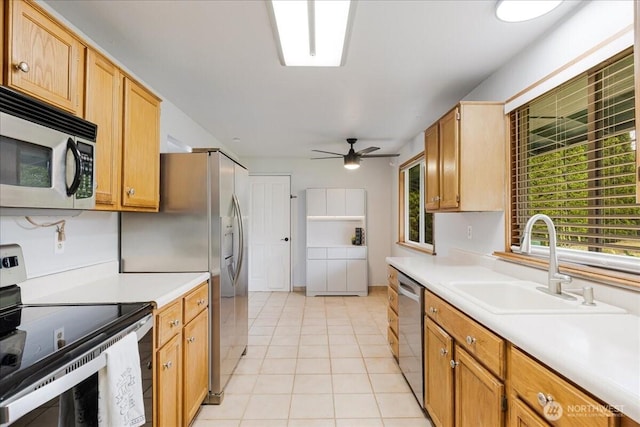 8315 NW 7th Ave, Vancouver, WA 98665 - kitchen with appliances with stainless steel finishes, a sink, light countertops, ceiling fan, and light tile patterned floors