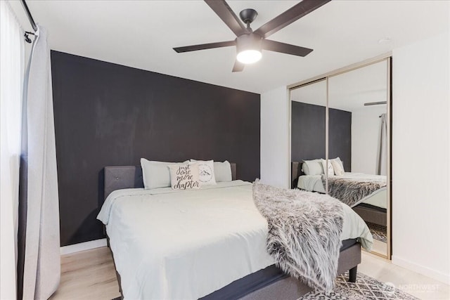 8315 NW 7th Ave, Vancouver, WA 98665 - bedroom with a closet, a ceiling fan, baseboards, and light wood-style flooring