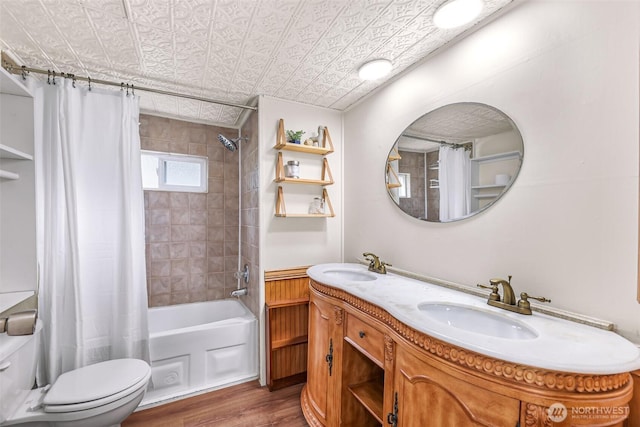 316 W Lake Samish Dr Unit 21, Bellingham, WA 98229 - bathroom featuring wood finished floors, shower / bath combination with curtain, toilet, double vanity, and an ornate ceiling