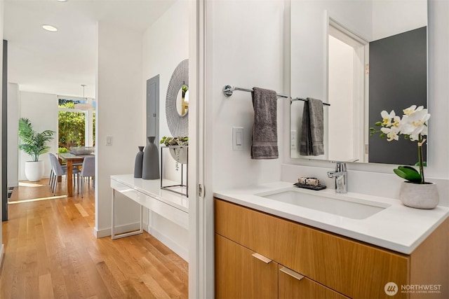5802 43rd Ave NE, Seattle, WA 98105 - bathroom with wood finished floors, vanity, and recessed lighting