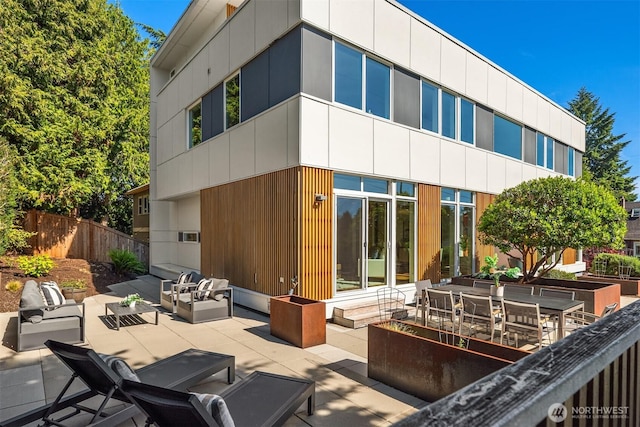 5802 43rd Ave NE, Seattle, WA 98105 - rear view of house featuring an outdoor hangout area and a patio area