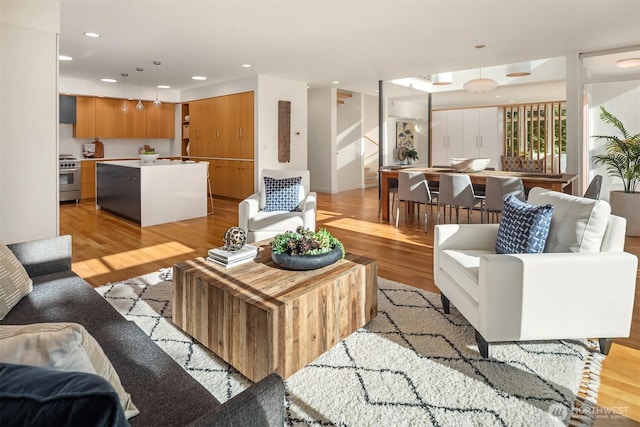 5802 43rd Ave NE, Seattle, WA 98105 - living area featuring light wood-style floors, stairs, and recessed lighting