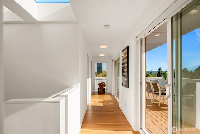5802 43rd Ave NE, Seattle, WA 98105 - corridor featuring a skylight and light wood-type flooring
