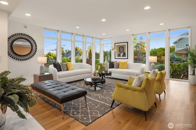 5802 43rd Ave NE, Seattle, WA 98105 - living area with floor to ceiling windows, healthy amount of natural light, wood finished floors, and recessed lighting