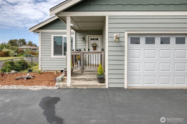 184 S Razor Clam Dr SW, Ocean Shores, WA 98569 - entrance to property featuring a garage