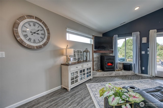 184 S Razor Clam Dr SW, Ocean Shores, WA 98569 - living area featuring lofted ceiling, wood finished floors, baseboards, a wood stove, and recessed lighting