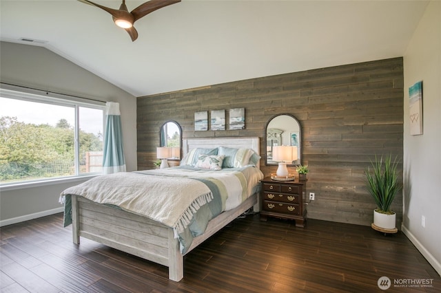 184 S Razor Clam Dr SW, Ocean Shores, WA 98569 - bedroom featuring lofted ceiling, wood walls, baseboards, wood finished floors, and a ceiling fan