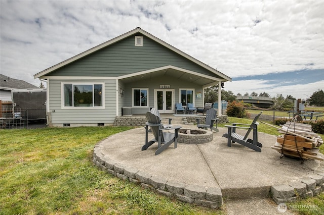 184 S Razor Clam Dr SW, Ocean Shores, WA 98569 - back of house with french doors, a fire pit, and a patio area