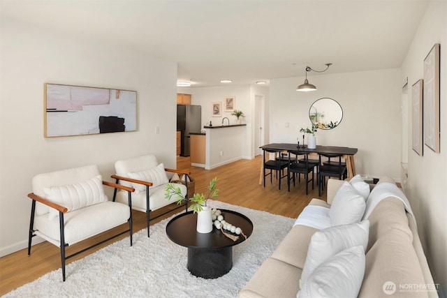 9057 Greenwood Ave N Unit 201, Seattle, WA 98103 - living area featuring light wood-type flooring, baseboards, and recessed lighting