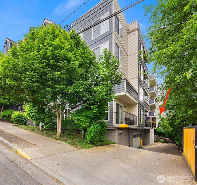 9057 Greenwood Ave N Unit 201, Seattle, WA 98103 - view of property with an attached garage