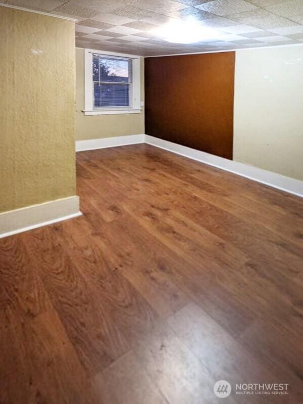 603 2nd St NW, Puyallup, WA 98371 - empty room with wood finished floors and baseboards