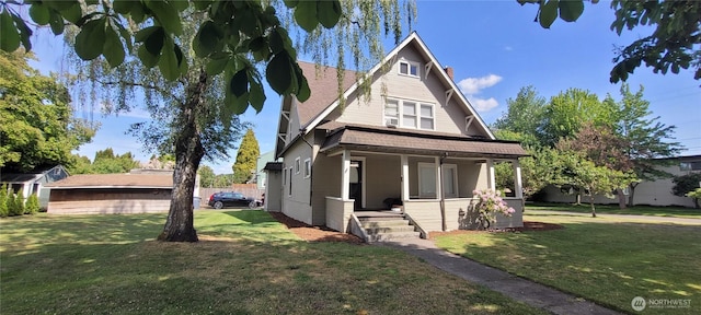 603 2nd St NW, Puyallup, WA 98371 - view of front facade with a porch, a front yard, a chimney, and roof with shingles