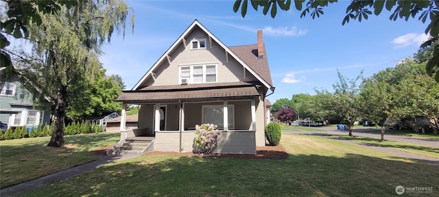 603 2nd St NW, Puyallup, WA 98371 - view of front facade featuring a porch, a front lawn, a chimney, and roof with shingles