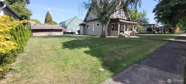 603 2nd St NW, Puyallup, WA 98371 - view of green lawn featuring covered porch