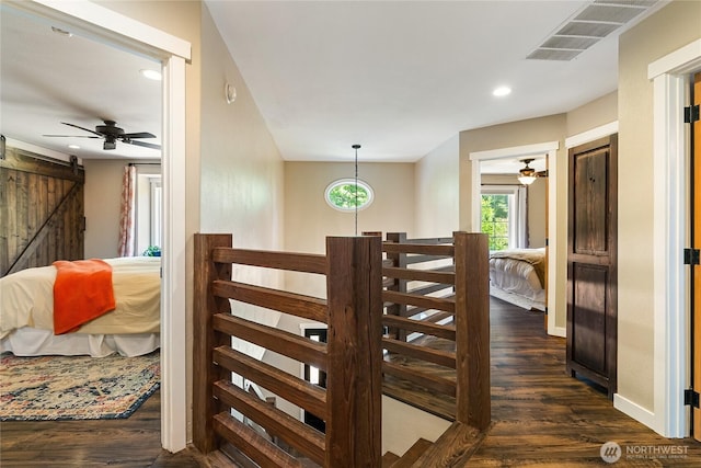 9111 Custer School Rd, Custer, WA 98240 - stairway featuring a barn door, wood finished floors, recessed lighting, a ceiling fan, and baseboards