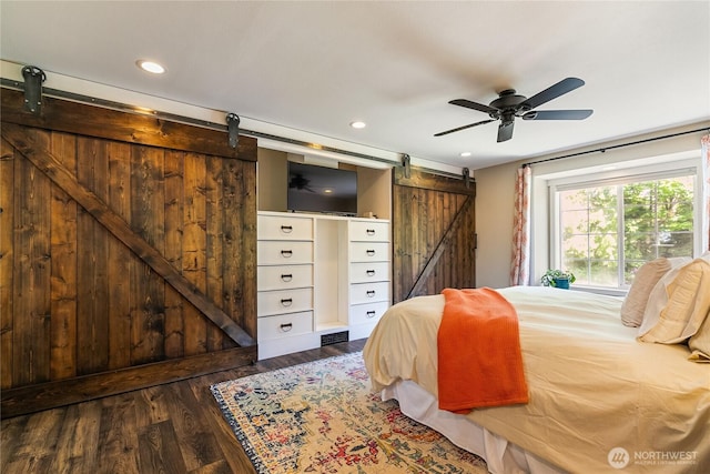 9111 Custer School Rd, Custer, WA 98240 - bedroom with a barn door, recessed lighting, and wood finished floors
