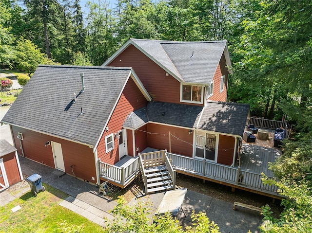 9111 Custer School Rd, Custer, WA 98240 - view of front of home with roof with shingles, a deck, and view of scattered trees