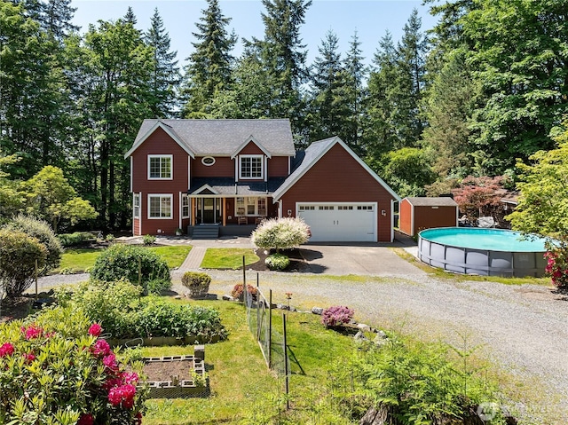 9111 Custer School Rd, Custer, WA 98240 - view of front of home featuring driveway, an attached garage, a front yard, and an outdoor pool