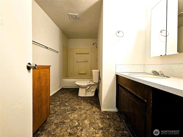 8927 178th Ave SW, Rochester, WA 98579 - full bathroom with vanity, toilet, shower / bathtub combination, stone finish floors, and baseboards