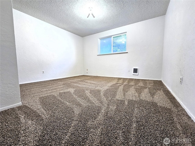 8927 178th Ave SW, Rochester, WA 98579 - empty room featuring a textured wall, carpet, a textured ceiling, and baseboards