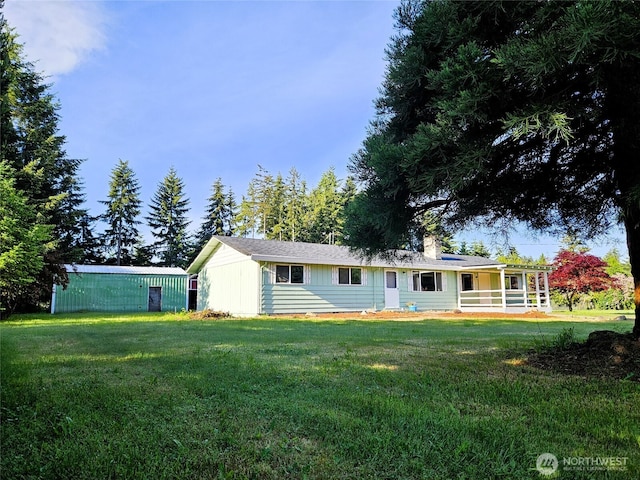 8927 178th Ave SW, Rochester, WA 98579 - back of house with a yard and a chimney