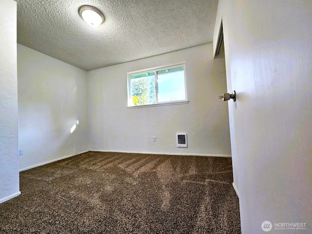 8927 178th Ave SW, Rochester, WA 98579 - unfurnished room with carpet floors, heating unit, a textured ceiling, and baseboards