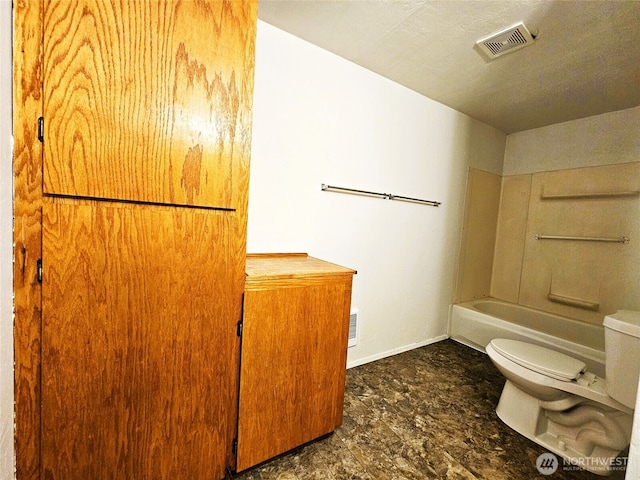 8927 178th Ave SW, Rochester, WA 98579 - bathroom with toilet, a tub, and baseboards