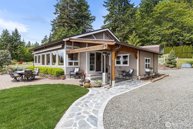 91 N Terrace Rd, Hoodsport, WA 98548 - back of property featuring a patio and a lawn