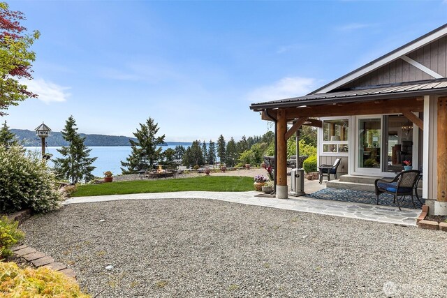 91 N Terrace Rd, Hoodsport, WA 98548 - view of yard with a patio and a water view