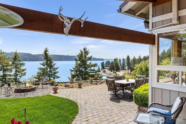 91 N Terrace Rd, Hoodsport, WA 98548 - view of patio / terrace featuring a fire pit, a water view, and outdoor dining space