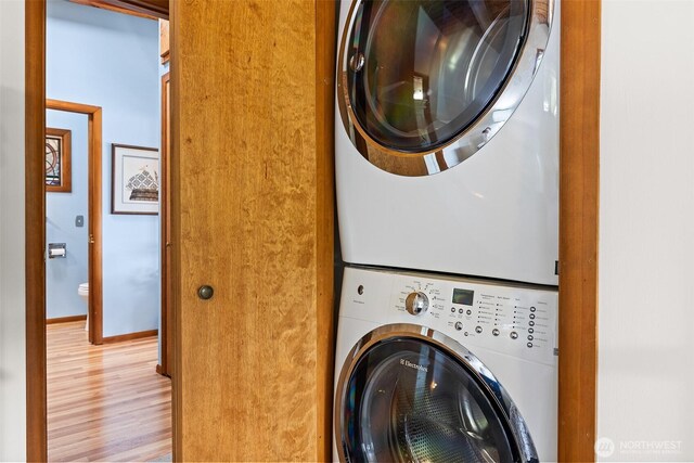 91 N Terrace Rd, Hoodsport, WA 98548 - laundry area with stacked washer / drying machine and light wood-type flooring