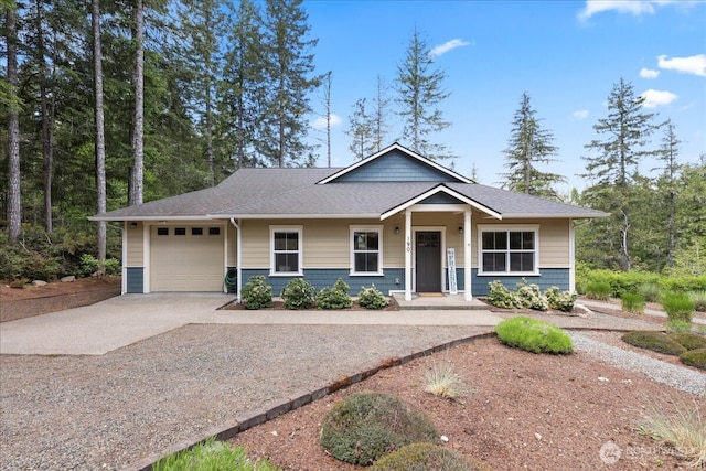 190 E Country Club Dr W, Union, WA 98592 - view of front of house with an attached garage, concrete driveway, and a shingled roof