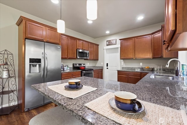 190 E Country Club Dr W, Union, WA 98592 - kitchen with appliances with stainless steel finishes, a sink, dark wood-style flooring, brown cabinets, and recessed lighting