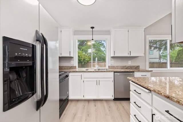 22014 48th Avenue Ct E, Spanaway, WA 98387 - kitchen featuring dishwasher, refrigerator with ice dispenser, electric range, a sink, and light wood-type flooring