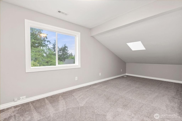 22014 48th Avenue Ct E, Spanaway, WA 98387 - additional living space with a skylight, plenty of natural light, carpet floors, vaulted ceiling, and baseboards