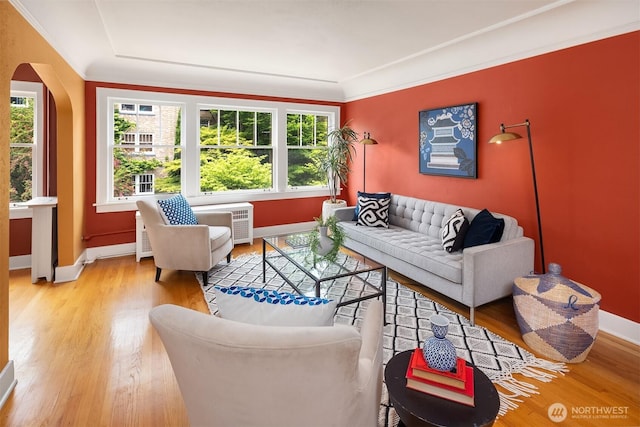 1605 E Olive St Unit 111, Seattle, WA 98122 - living area with arched walkways, light wood finished floors, and baseboards