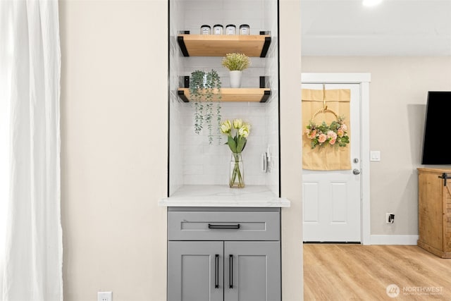 5116 N 40th St, Tacoma, WA 98407 - detailed view of wood finished floors, decorative backsplash, and baseboards