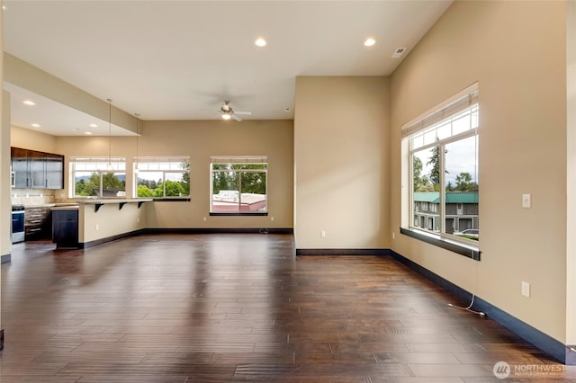 4020 NE 3rd Pl Unit B, Renton, WA 98056 - unfurnished living room featuring plenty of natural light, ceiling fan, dark wood-type flooring, recessed lighting, and baseboards