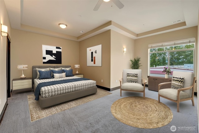 4020 NE 3rd Pl Unit B, Renton, WA 98056 - bedroom featuring carpet flooring, a tray ceiling, baseboards, and ceiling fan
