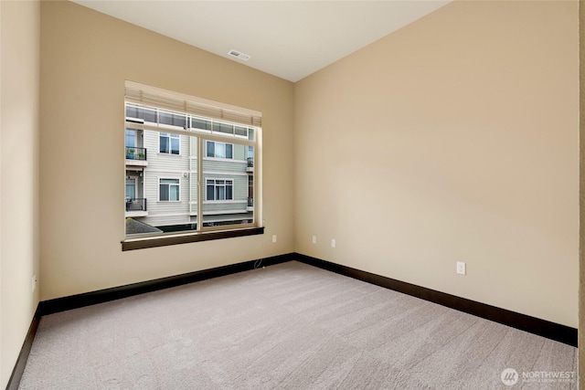 4020 NE 3rd Pl Unit B, Renton, WA 98056 - empty room featuring baseboards and carpet floors