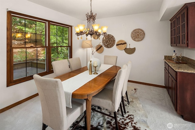 6220 146th Pl SE, Bellevue, WA 98006 - dining space with light colored carpet, a chandelier, and baseboards