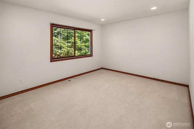 6220 146th Pl SE, Bellevue, WA 98006 - spare room featuring light colored carpet, baseboards, and recessed lighting