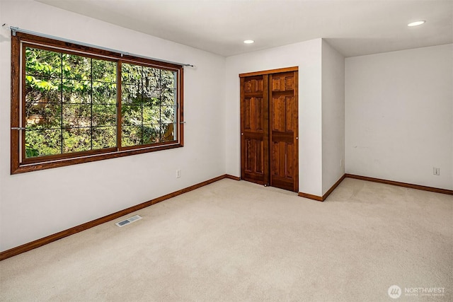 6220 146th Pl SE, Bellevue, WA 98006 - unfurnished bedroom featuring light colored carpet, baseboards, recessed lighting, and a closet
