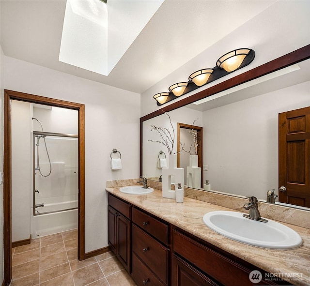 6220 146th Pl SE, Bellevue, WA 98006 - full bath featuring double vanity, shower / tub combination, tile patterned flooring, baseboards, and a skylight
