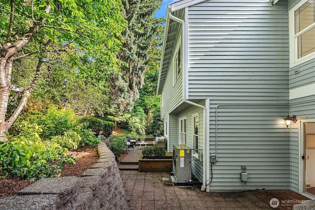 6220 146th Pl SE, Bellevue, WA 98006 - view of home's exterior with a patio area and a deck