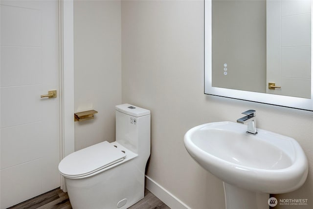 6726 NE 187th St Unit 104, Kenmore, WA 98028 - half bath featuring wood finished floors, toilet, and a sink