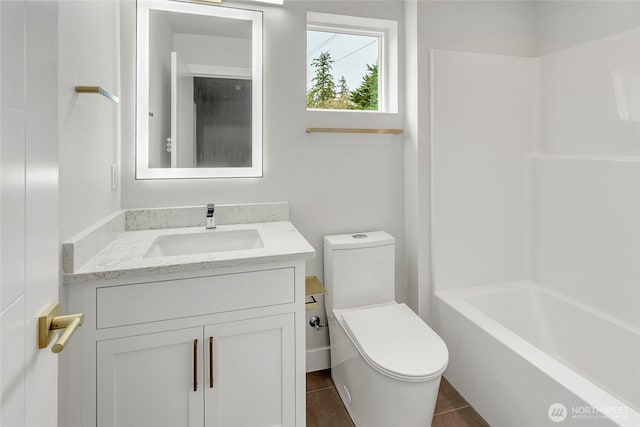 6726 NE 187th St Unit 104, Kenmore, WA 98028 - bathroom featuring toilet, vanity, shower / bathtub combination, and tile patterned floors